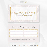 Projekt złoconego terminarzyka wizyt na jasnym satynowym tle