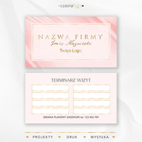 Złocony projekt terminarzyka wizyt na satynowym różowym tle