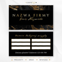 Projekt terminarzyka wizyt ze złotą czcionką na marmurowym czarnym tle