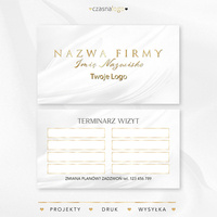 Złocony projekt terminarzyka wizyt na białym satynowym tle