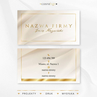 Elegancki projekt złoconej wizytówki na satynowym beżowym tle